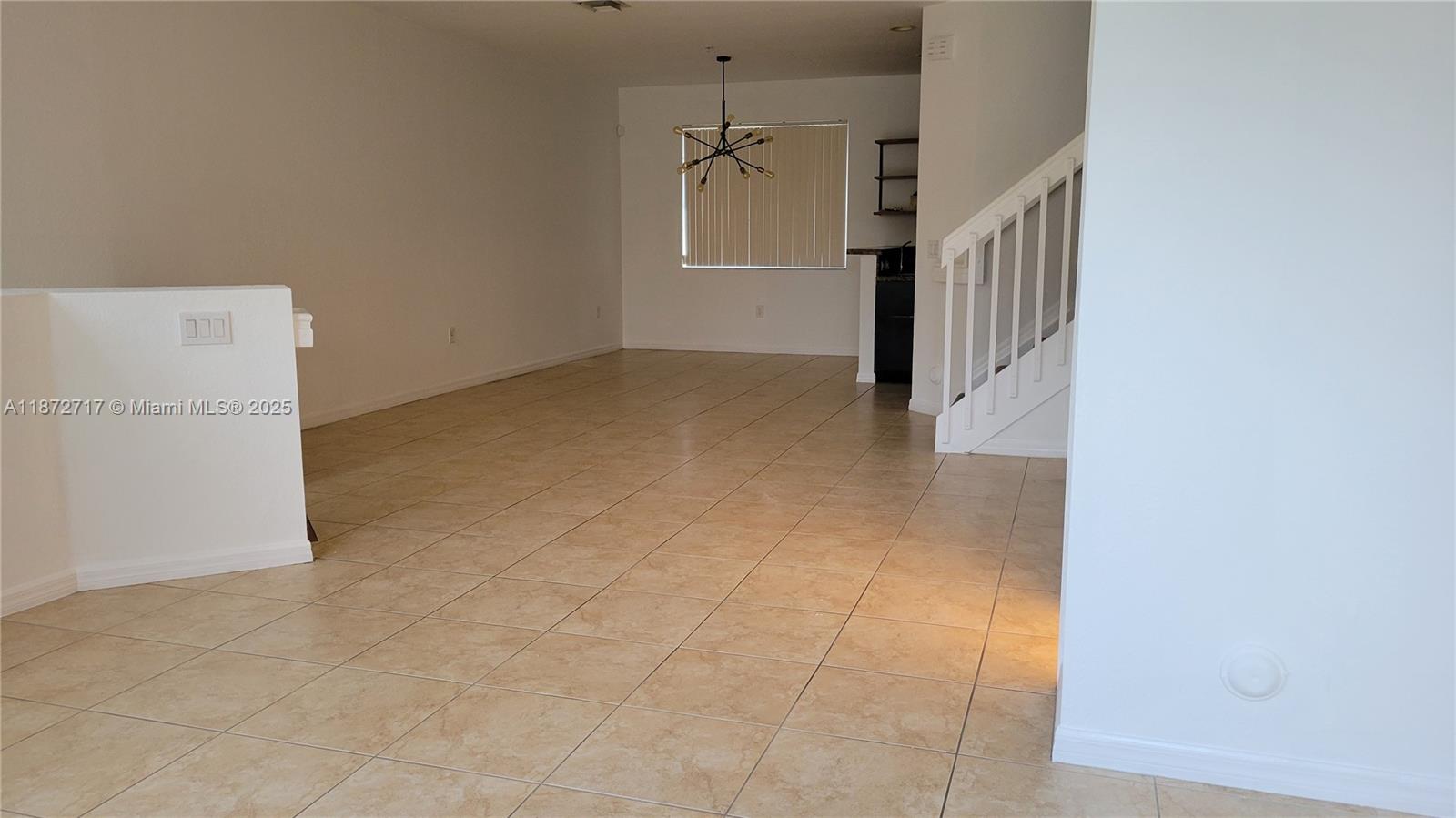 12600 Southwest 50th Court, Unit 437 Miramar, FL 33027 - Photo 27 of 28 a view of a hallway with a white walls
