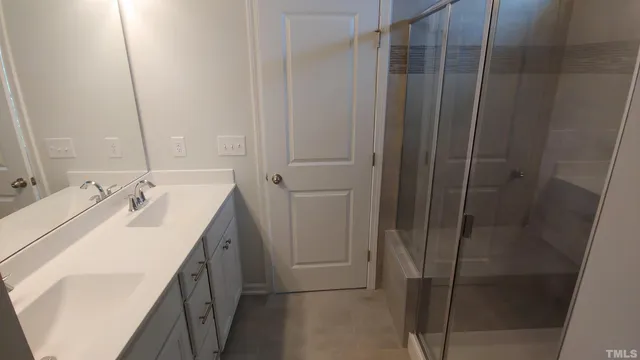 a bathroom with a sink and mirror