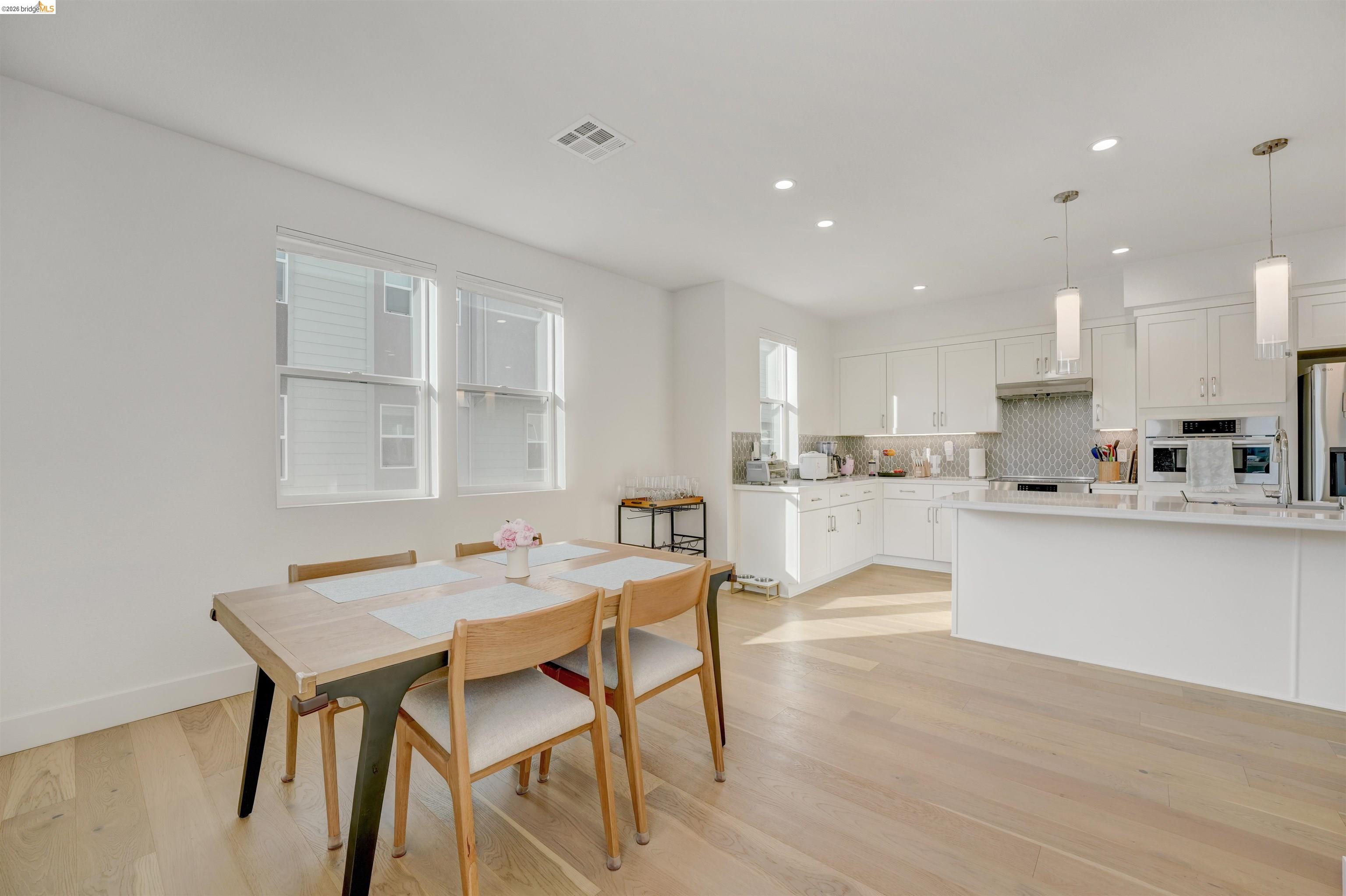 7101 Melon Court San Ramon, CA 94583 - Photo 26 of 58 a open dining room with kitchen island a stove a table and chairs