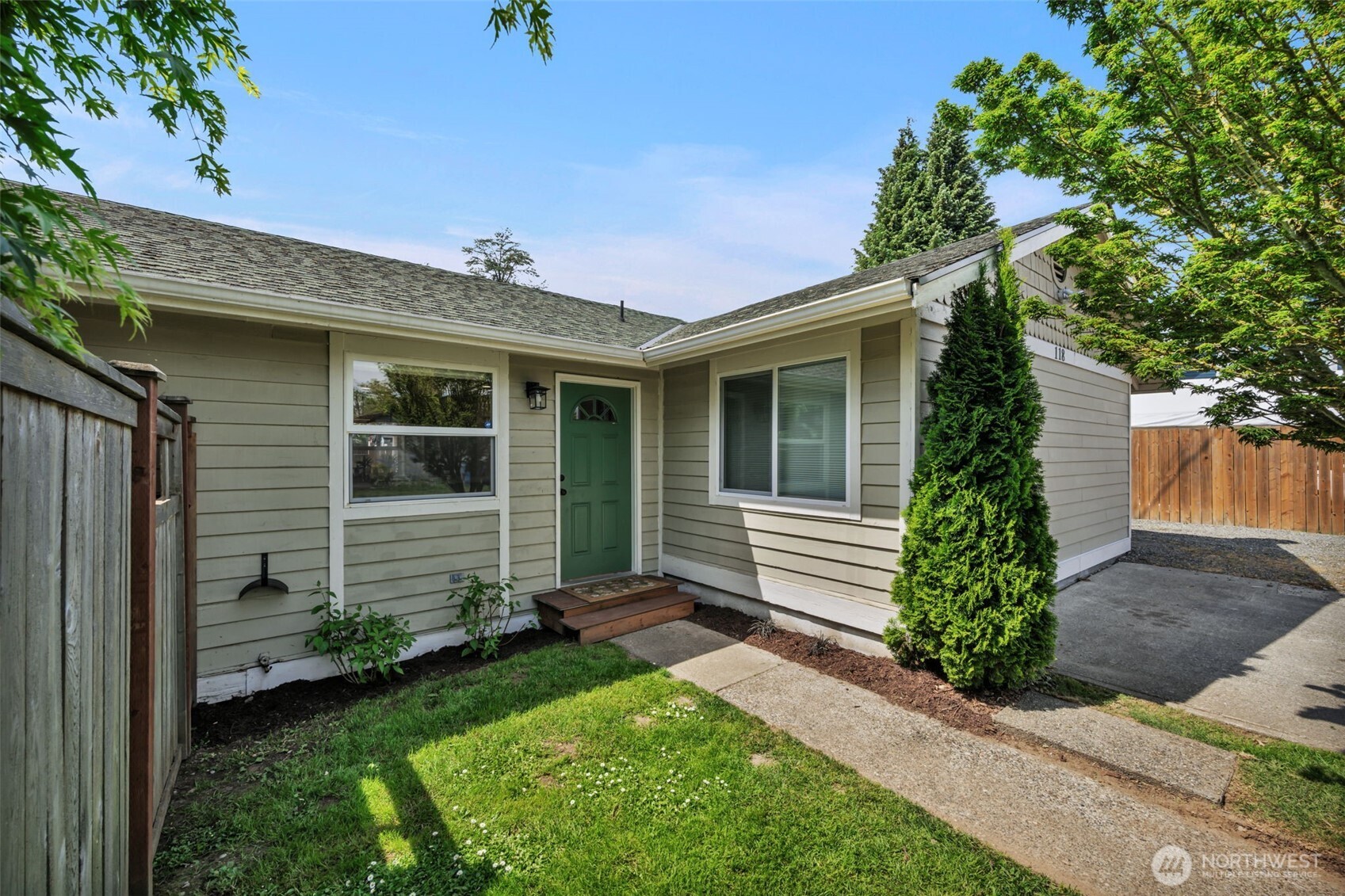 a front view of a house with garden