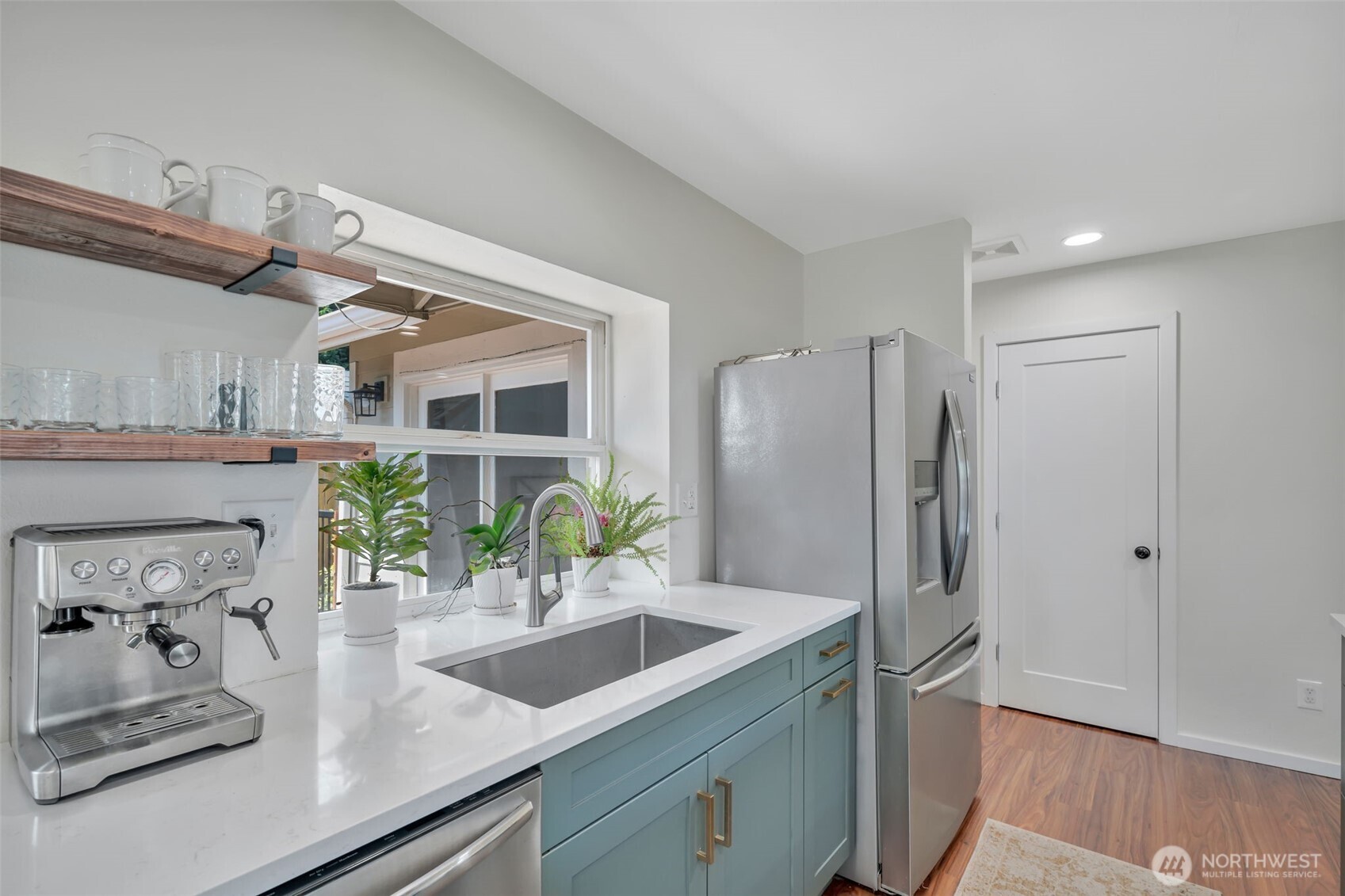 118 Morris Street Monroe, WA 98272 - Photo 14 of 35 a kitchen with stainless steel appliances granite countertop a sink and a refrigerator