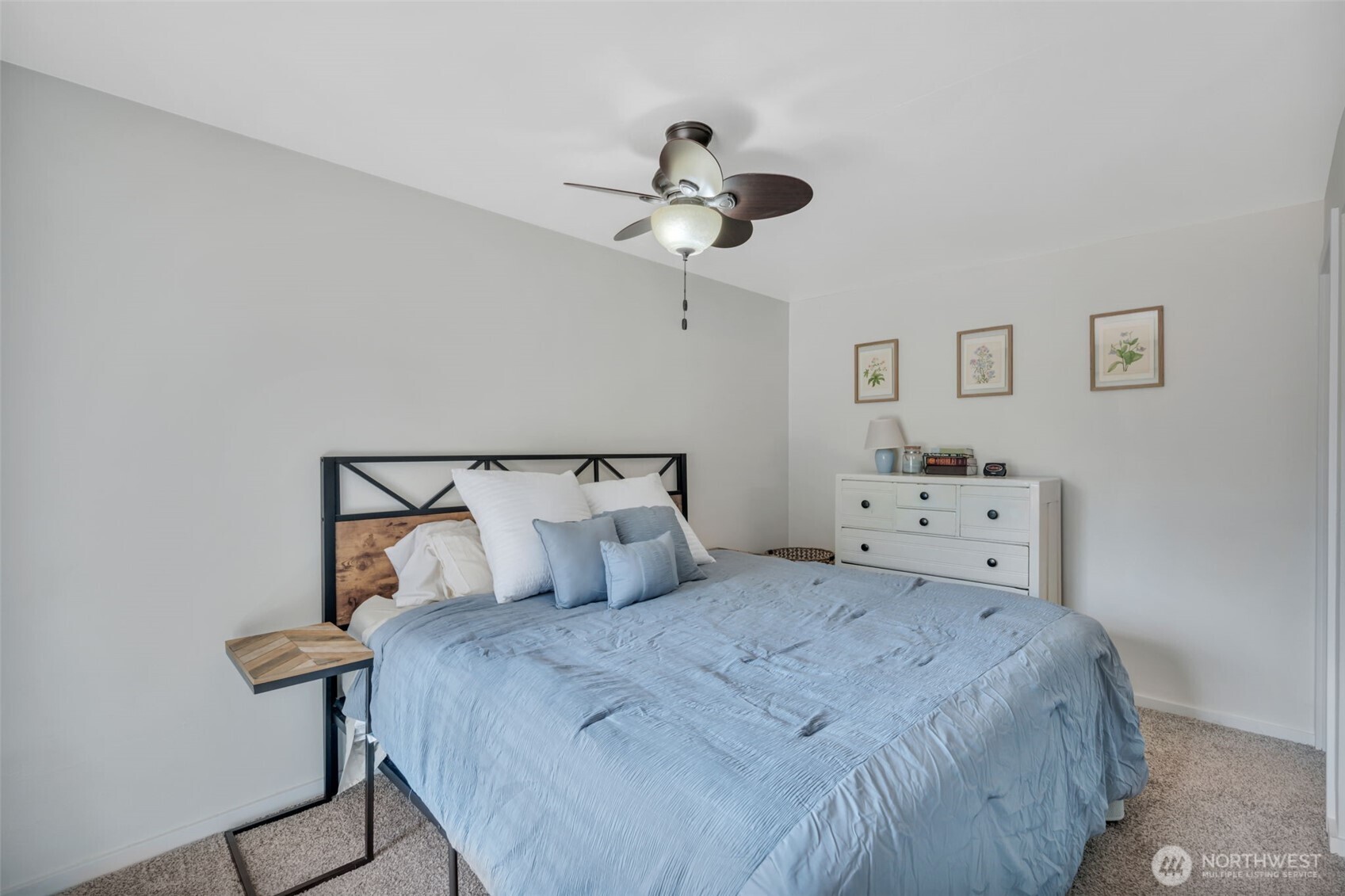 118 Morris Street Monroe, WA 98272 - Photo 17 of 35 a bedroom with a bed and a chandelier
