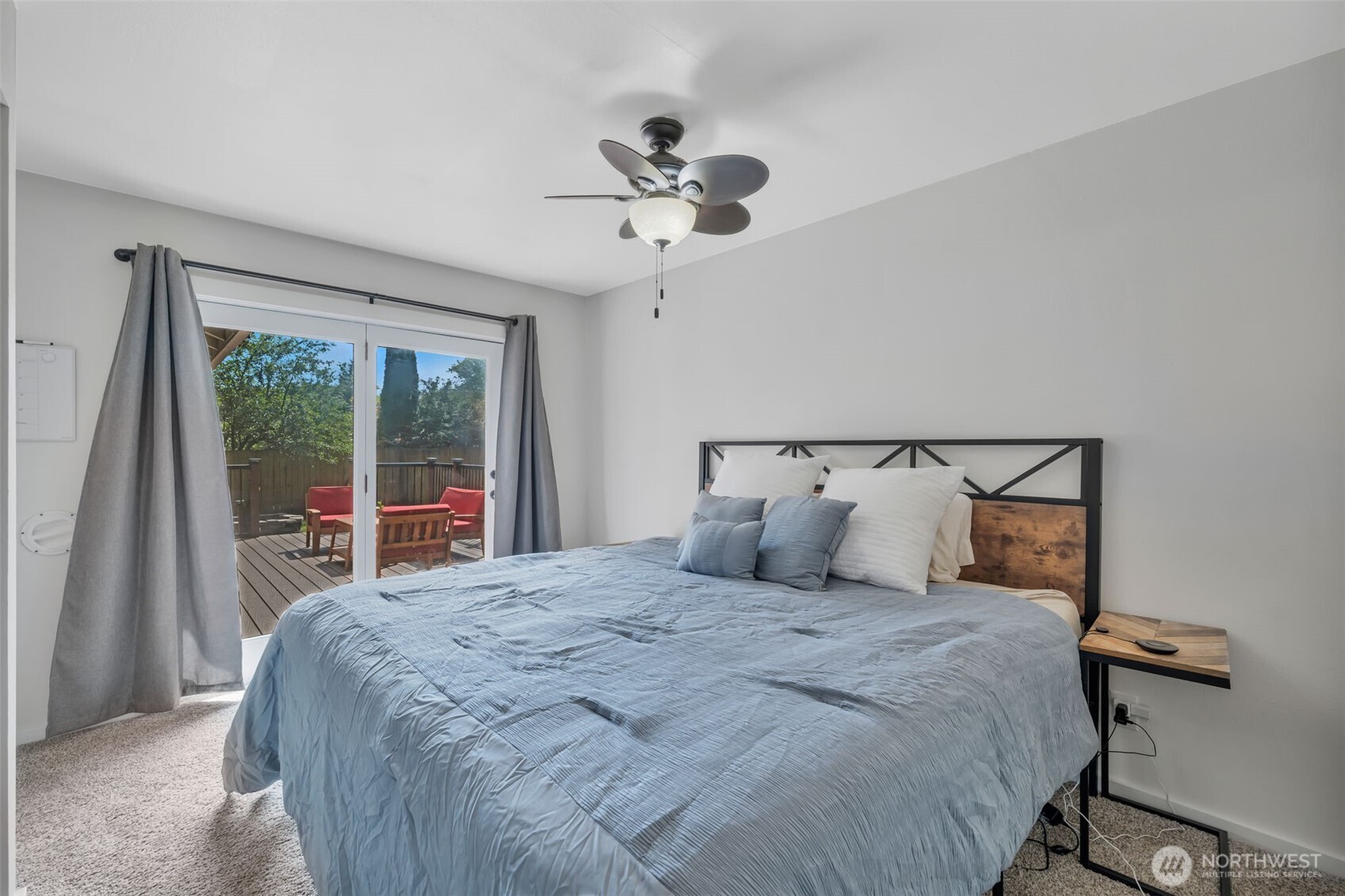 118 Morris Street Monroe, WA 98272 - Photo 18 of 35 a bedroom with a large bed and a chandelier