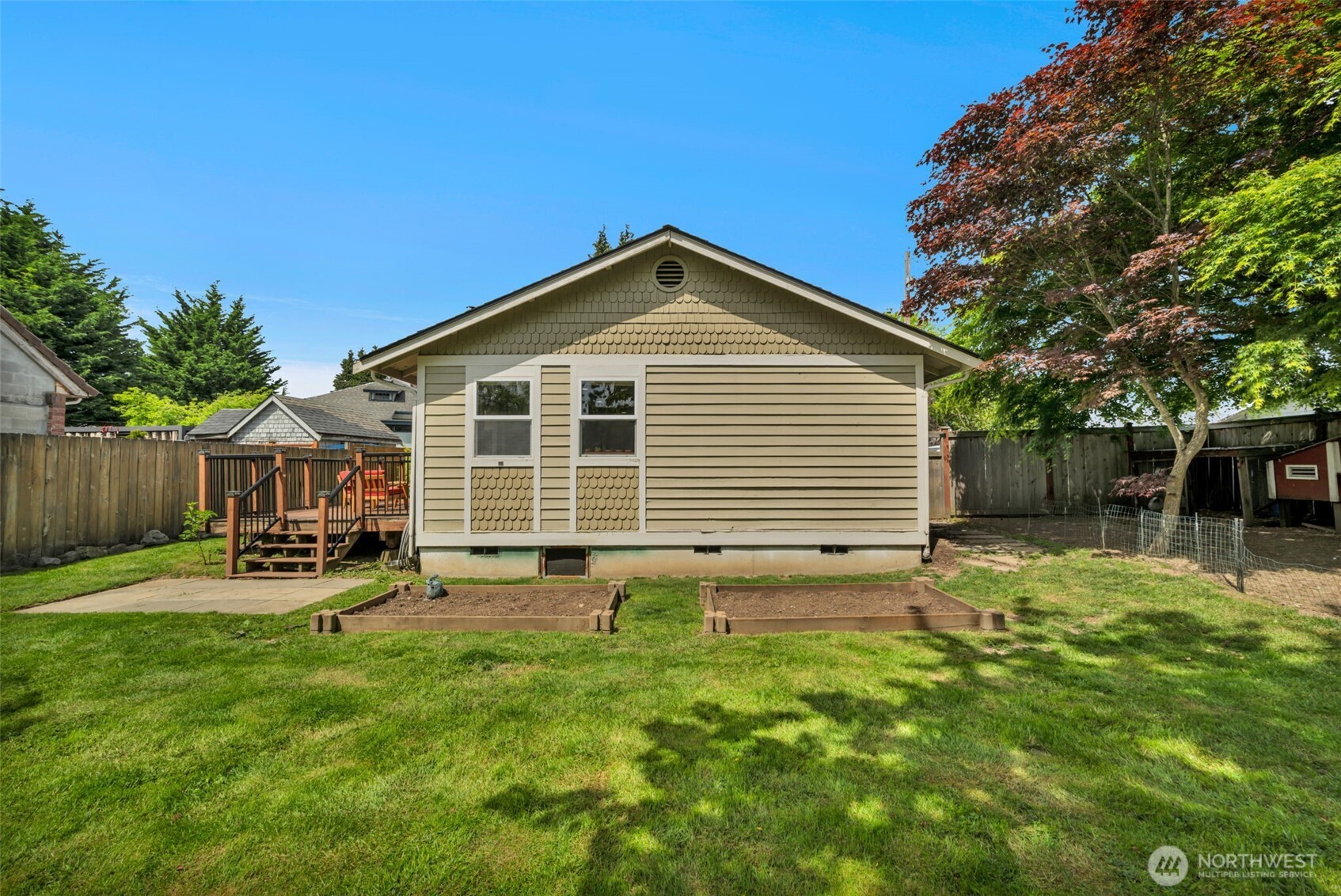 118 Morris Street Monroe, WA 98272 - Photo 30 of 35 a backyard of a house with table and chairs