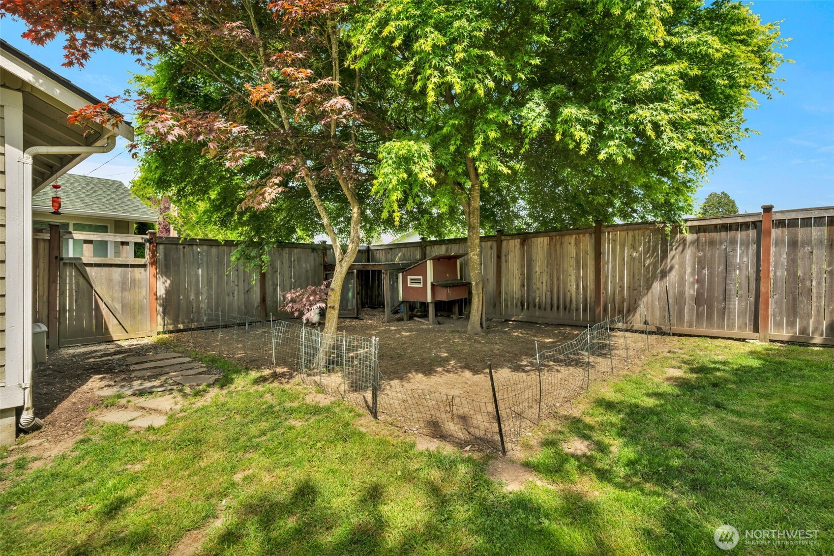 118 Morris Street Monroe, WA 98272 - Photo 32 of 35 a view of a backyard with a tree