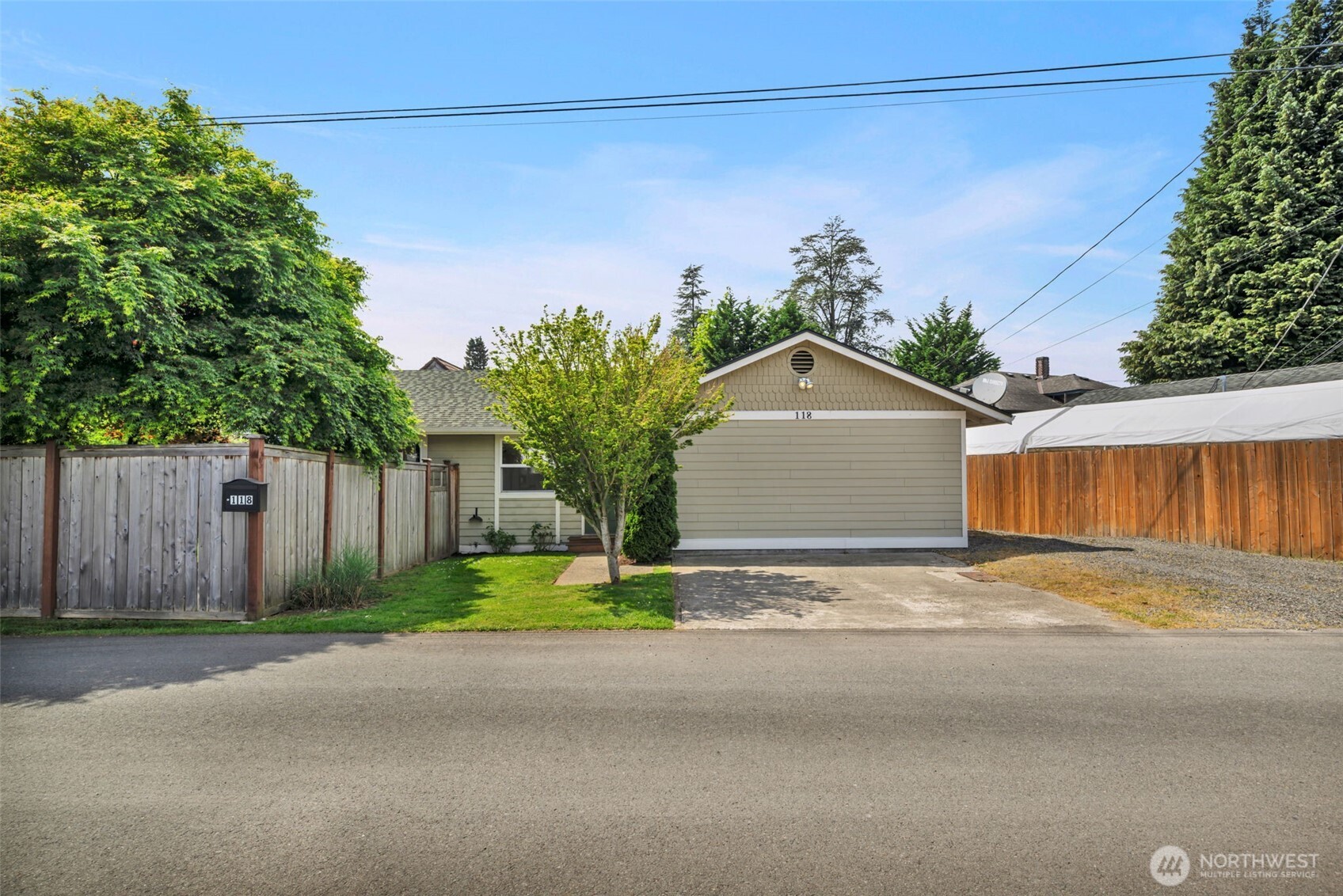 118 Morris Street Monroe, WA 98272 - Photo 34 of 35 a front view of a house with a yard and garage