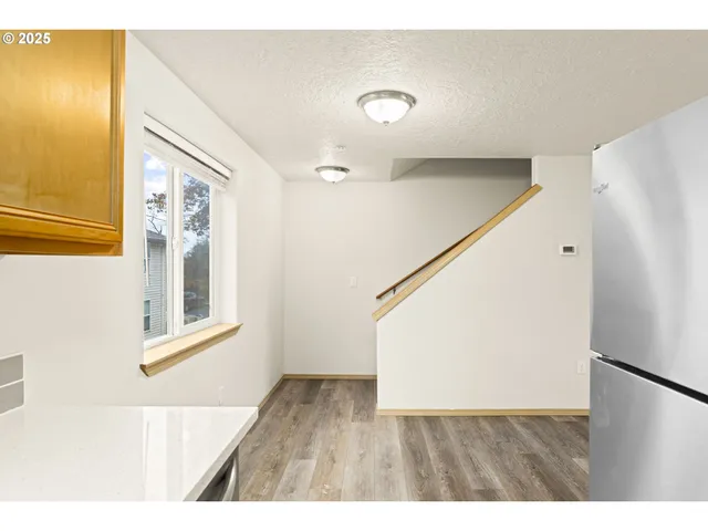 a view of an entryway with wooden floor