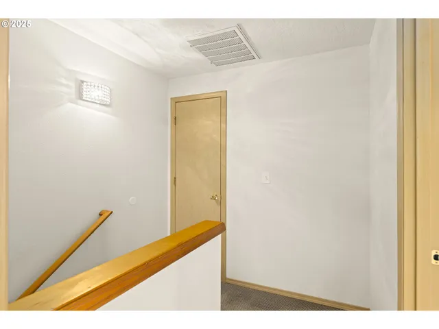 a view of hallway with stairs