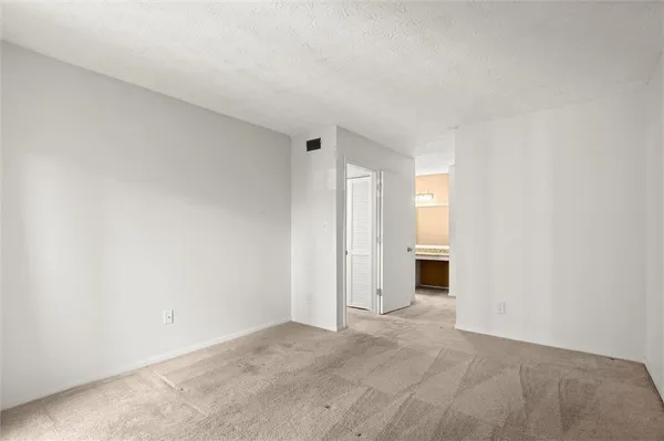 a view of a room with racks on the wall
