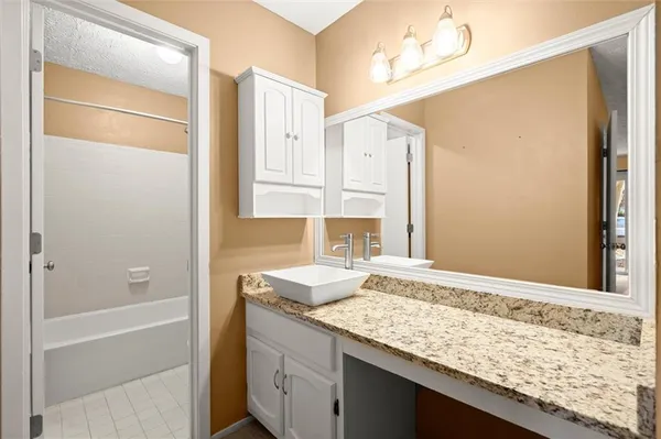 a bathroom with a shower a toilet and a shower