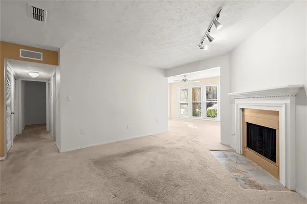 a view of livingroom with furniture and windows