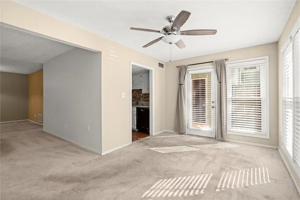 a view of livingroom with a ceiling fan