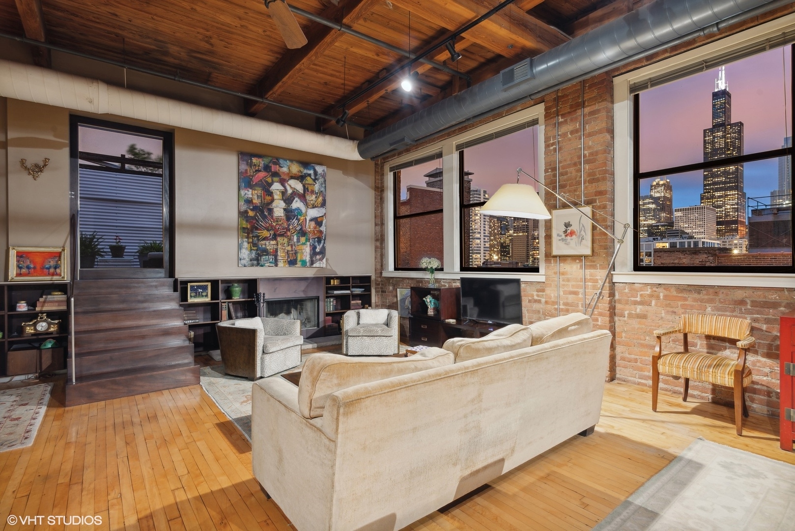 411 South Sangamon Street, Unit 8E Chicago, IL 60607 - Photo 11 of 25 a living room with fireplace furniture and a large window