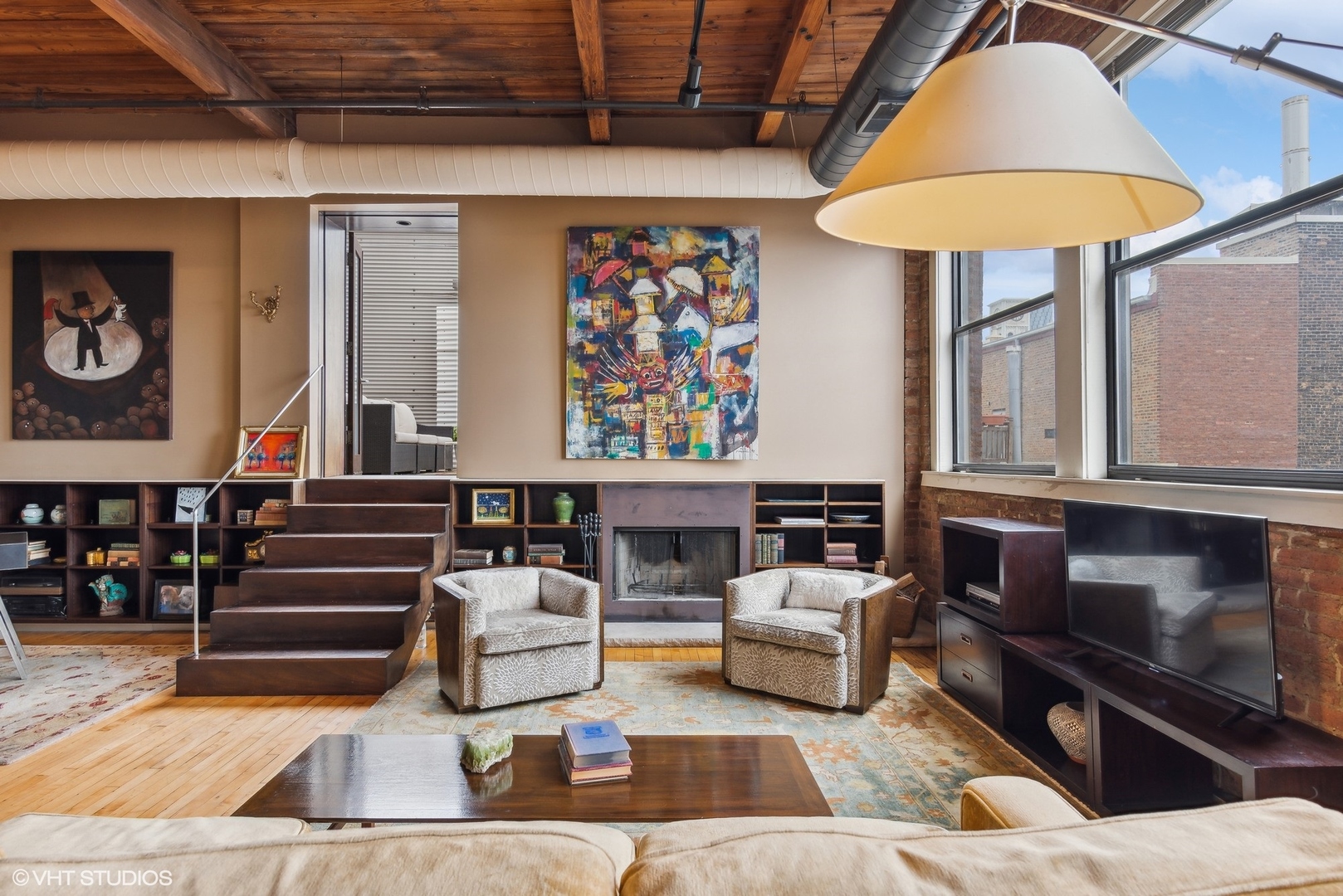 411 South Sangamon Street, Unit 8E Chicago, IL 60607 - Photo 13 of 25 a living room with furniture and a table
