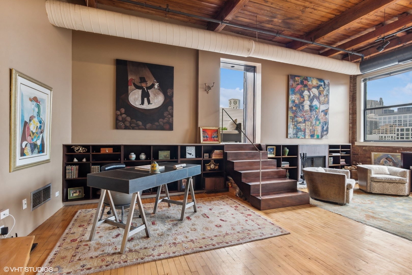 411 South Sangamon Street, Unit 8E Chicago, IL 60607 - Photo 15 of 25 a living room with furniture and paintings on the wall