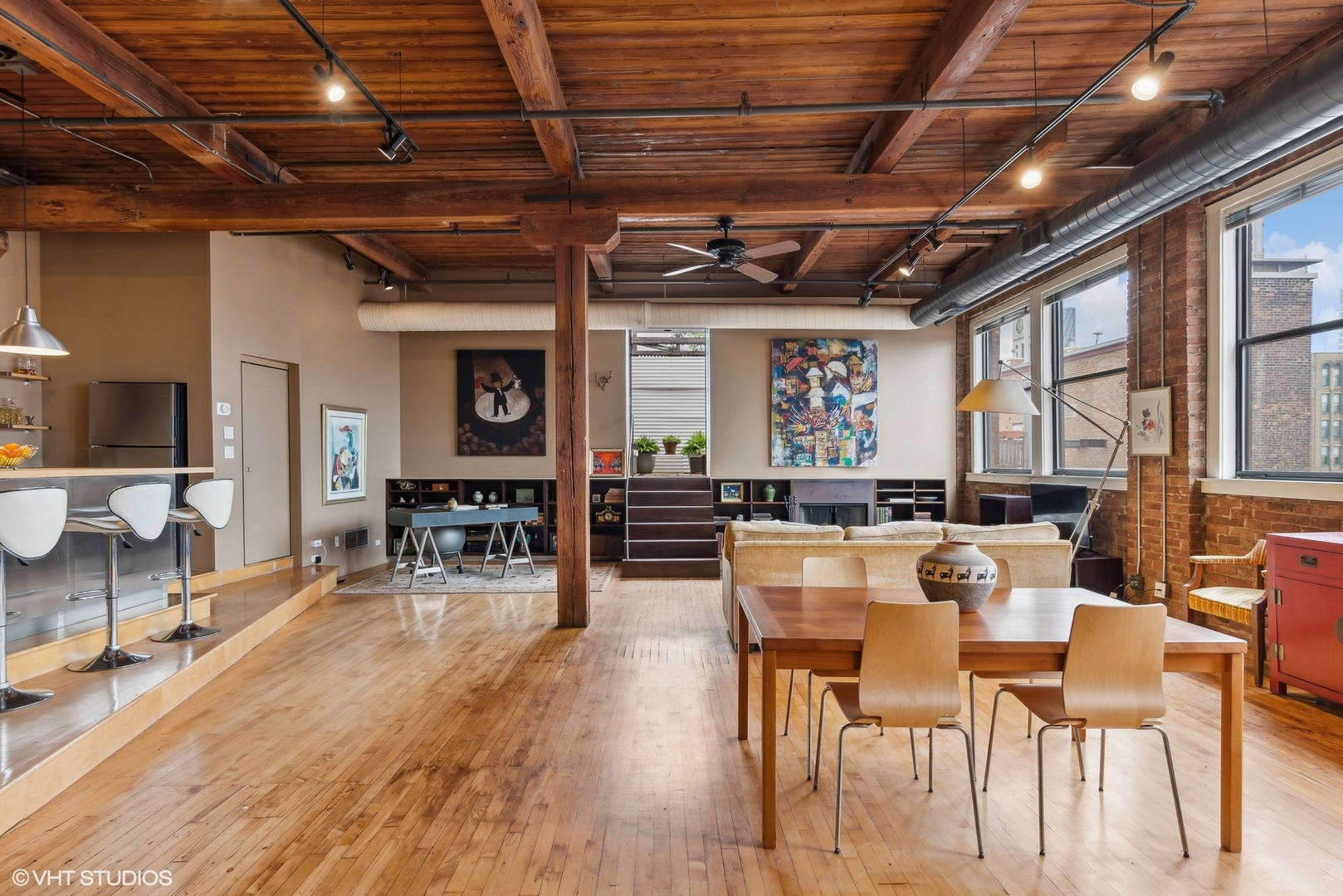 411 South Sangamon Street, Unit 8E Chicago, IL 60607 - Photo 16 of 25 a view of a dining room with furniture window and wooden floor