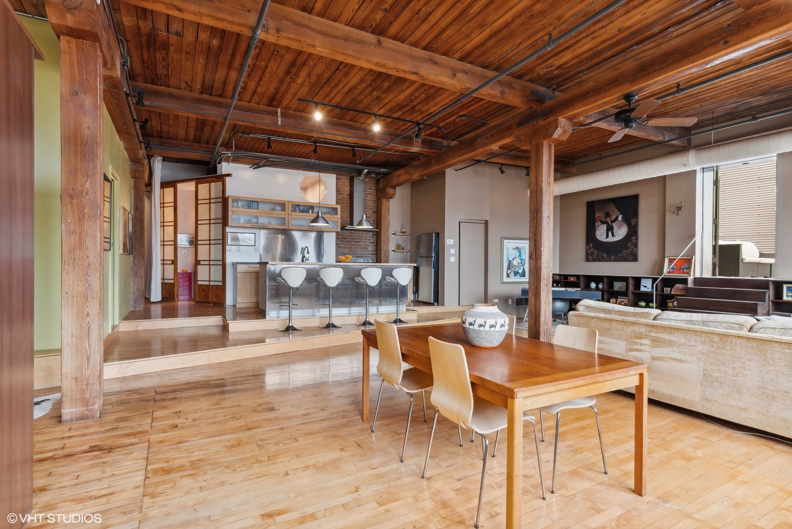 411 South Sangamon Street, Unit 8E Chicago, IL 60607 - Photo 17 of 25 a view of a dining hall with couches chairs and couches