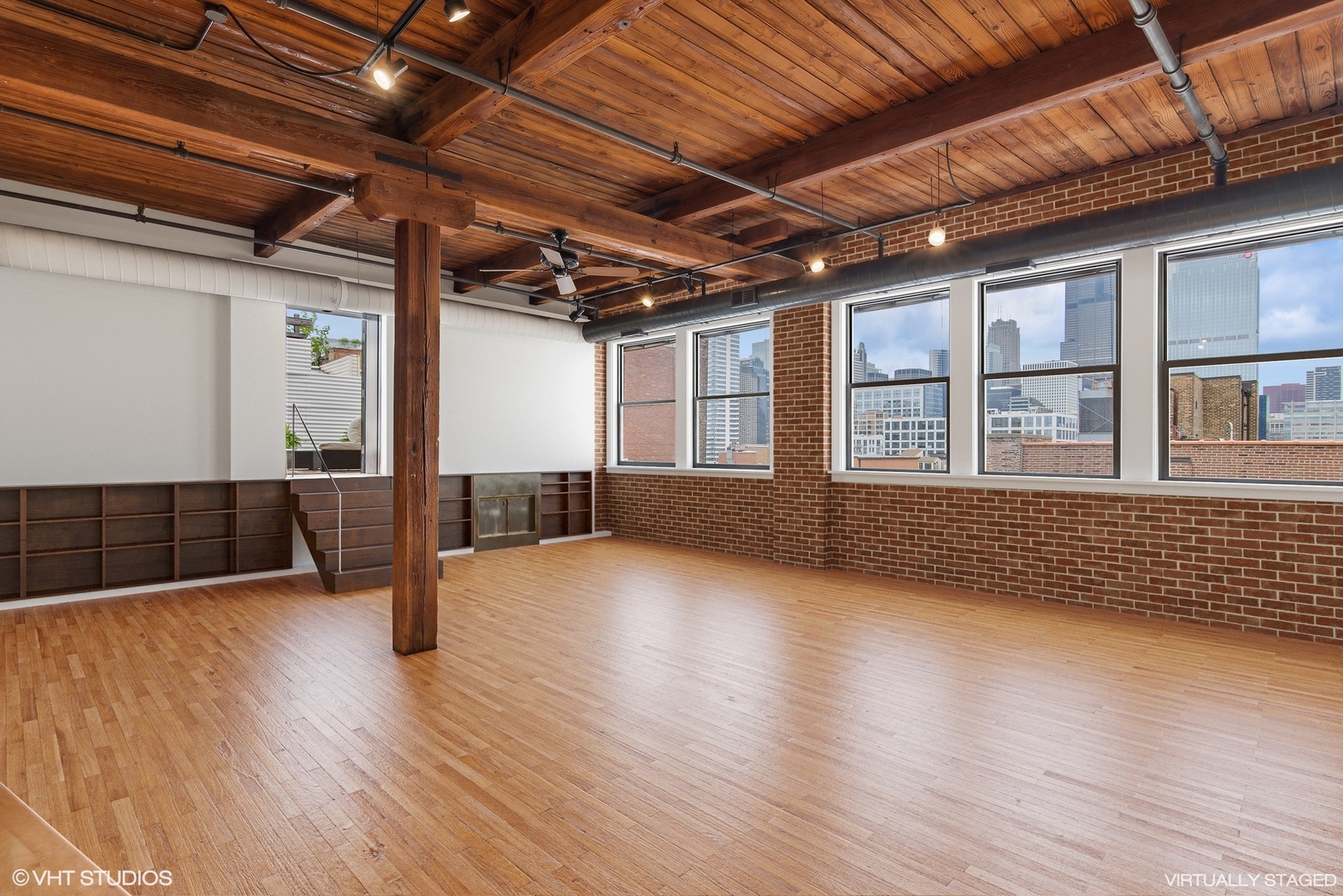 411 South Sangamon Street, Unit 8E Chicago, IL 60607 - Photo 2 of 25 a view of an empty room with wooden floor and a window