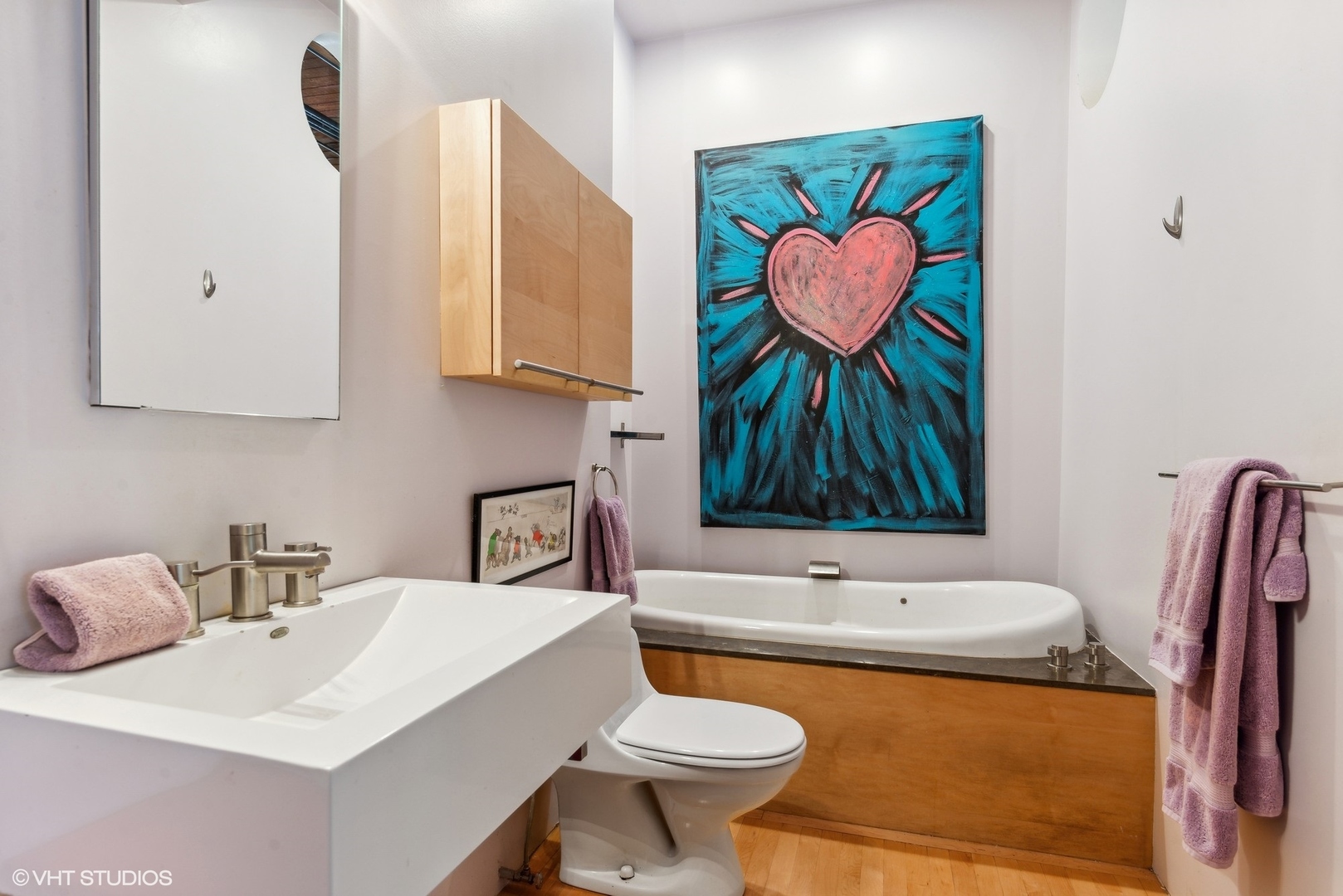 411 South Sangamon Street, Unit 8E Chicago, IL 60607 - Photo 23 of 25 a bathroom with a sink a toilet and mirror
