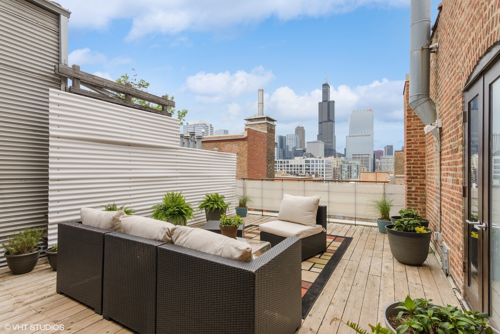 411 South Sangamon Street, Unit 8E Chicago, IL 60607 - Photo 4 of 25 a view of a terrace with chairs