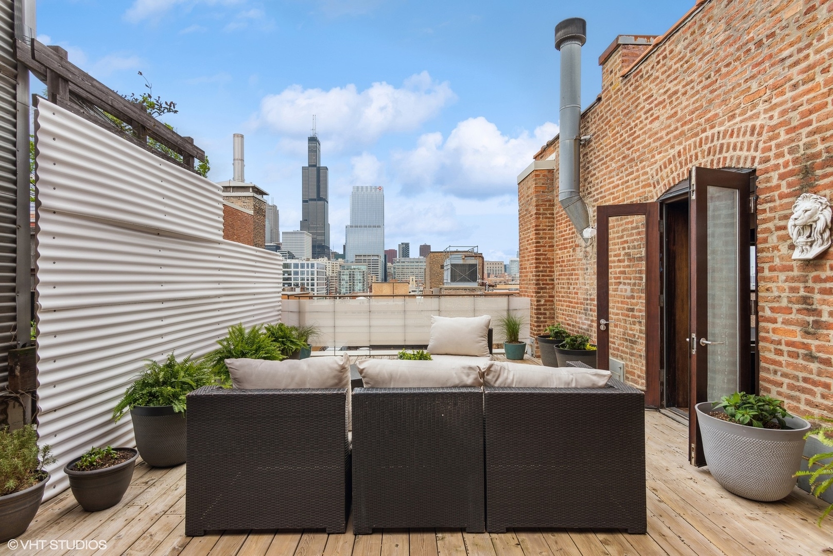 411 South Sangamon Street, Unit 8E Chicago, IL 60607 - Photo 5 of 25 a terrace with outdoor seating and city view
