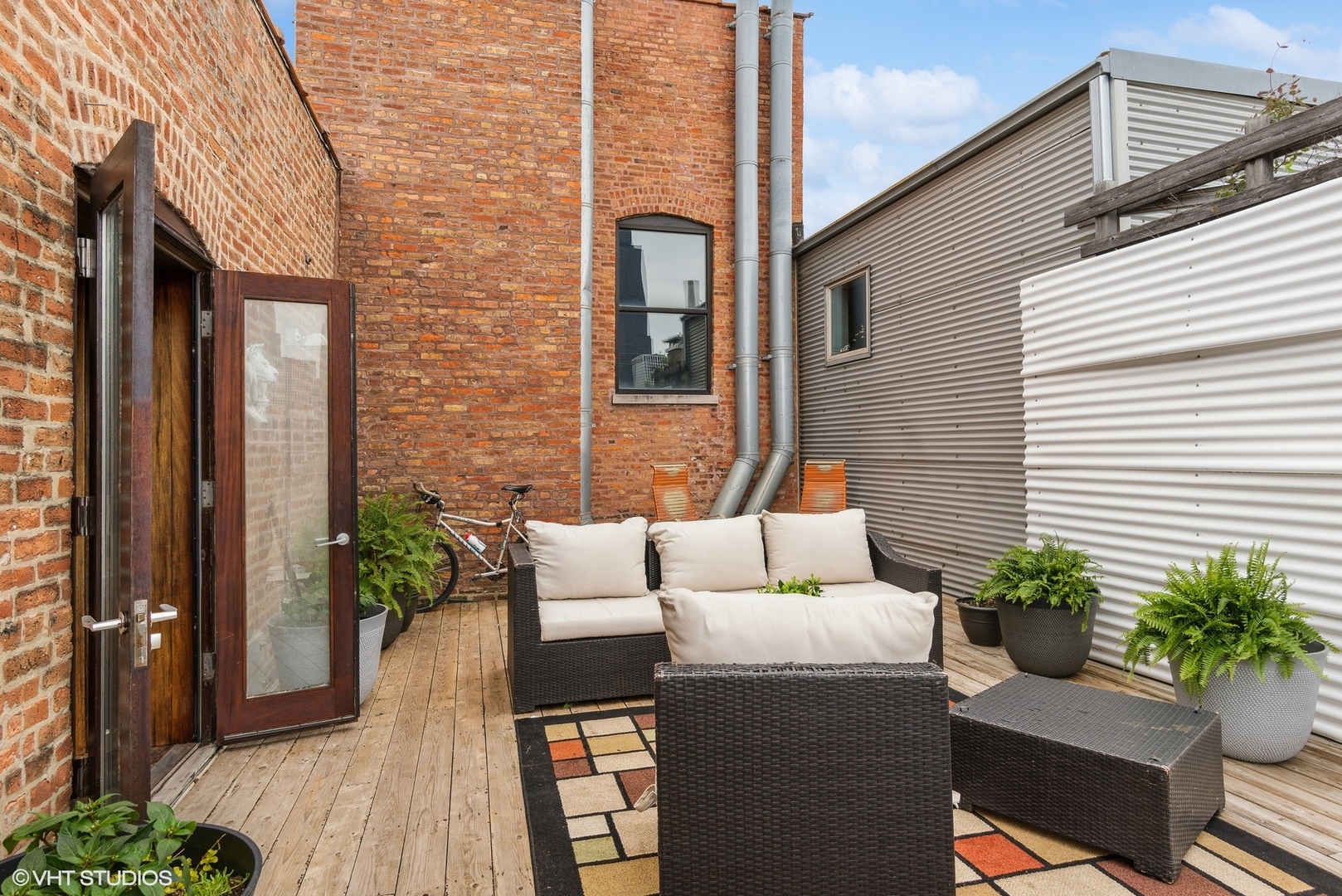 411 South Sangamon Street, Unit 8E Chicago, IL 60607 - Photo 7 of 25 a view of a house with couches chairs and wooden floor