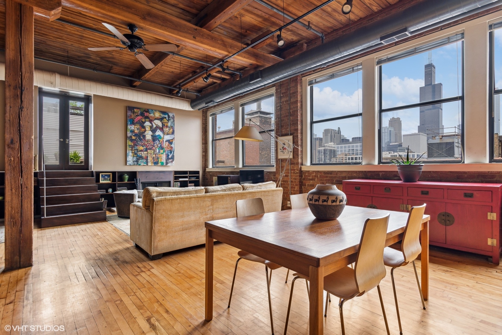 411 South Sangamon Street, Unit 8E Chicago, IL 60607 - Photo 10 of 25 a dining room with furniture a chandelier and wooden floor