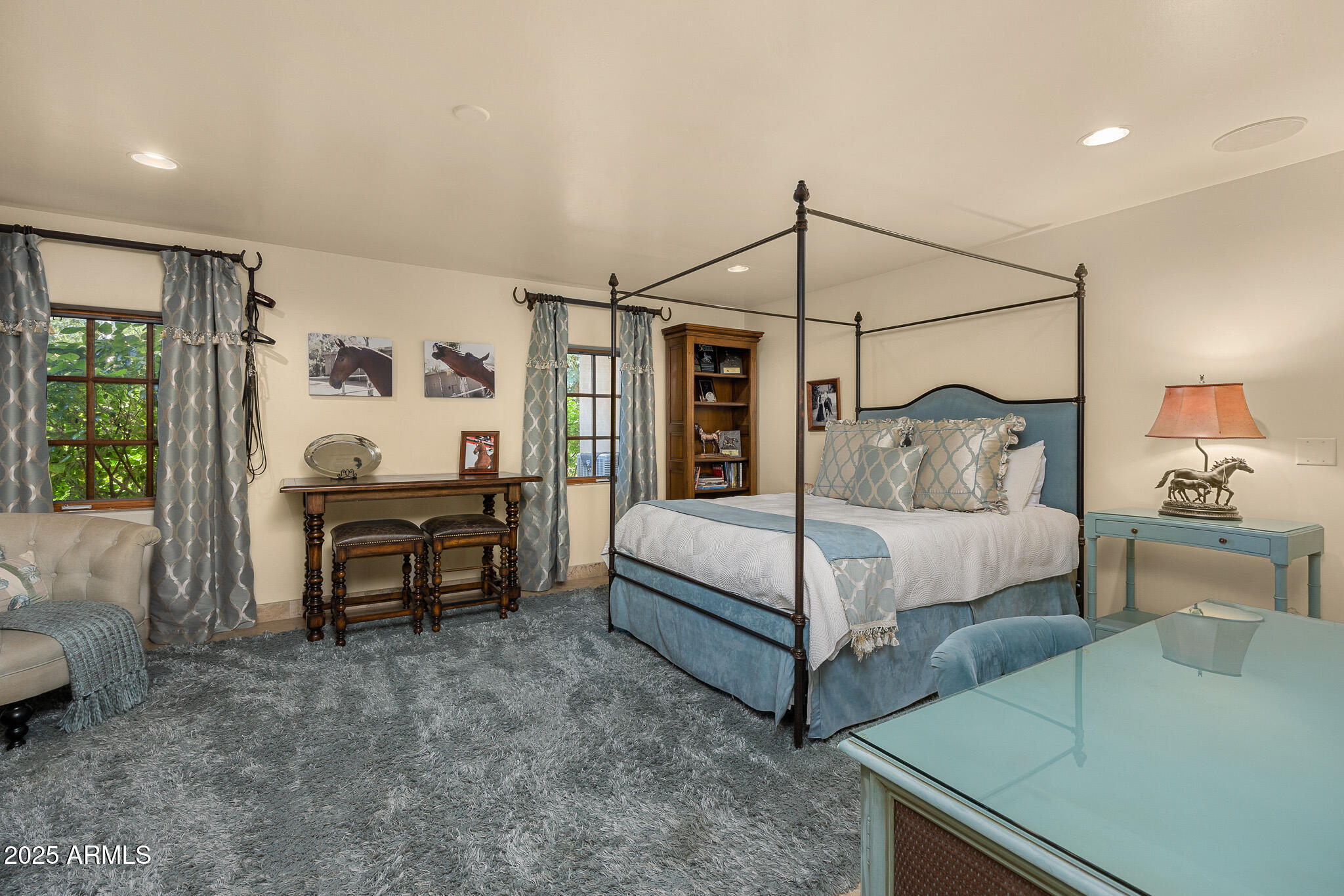 6000 North Palo Cristi Road Paradise Valley, AZ 85253 - Photo 27 of 62 a bedroom with a bed and a chandelier