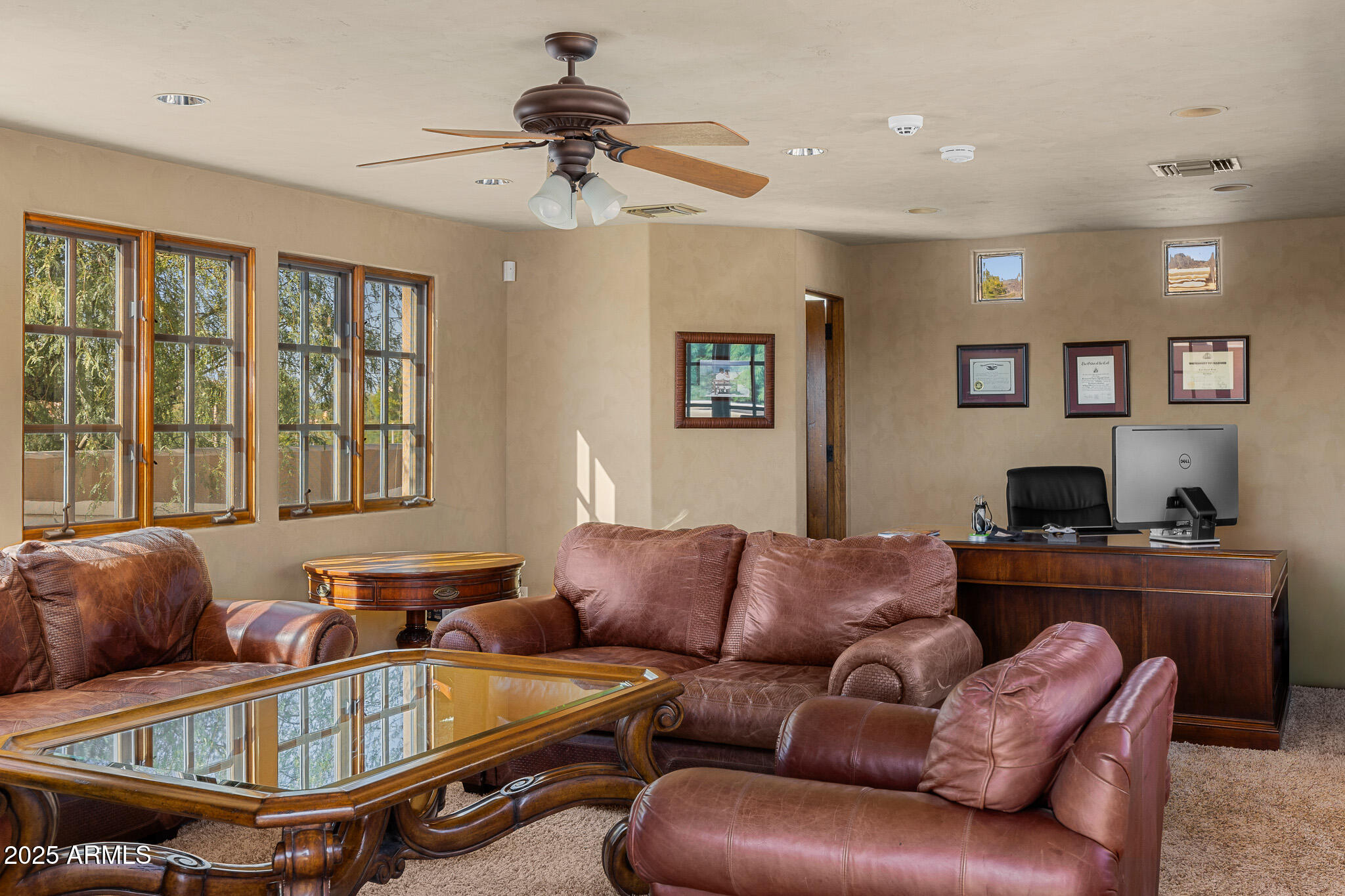 6000 North Palo Cristi Road Paradise Valley, AZ 85253 - Photo 29 of 62 a living room with furniture a ceiling fan and a window