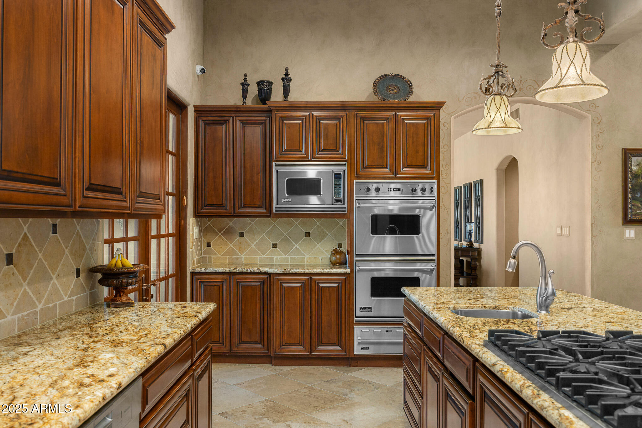 6000 North Palo Cristi Road Paradise Valley, AZ 85253 - Photo 9 of 62 a kitchen with a stove and a sink