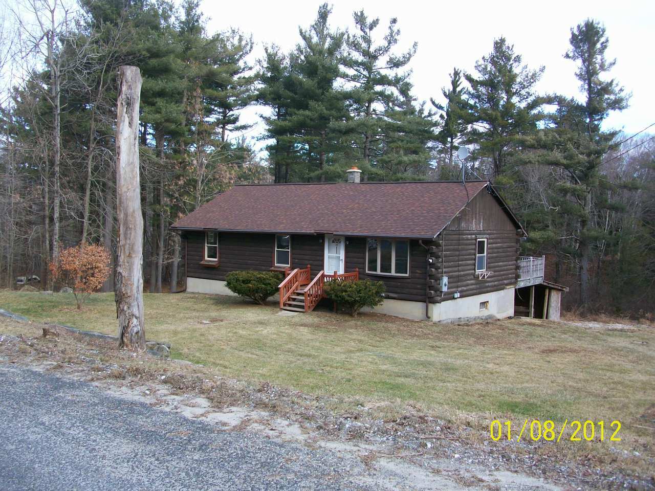 819 Bonny Rigg Hill Road Becket, MA 01223 - Photo 1 of 7 a house that has a tree in front of it