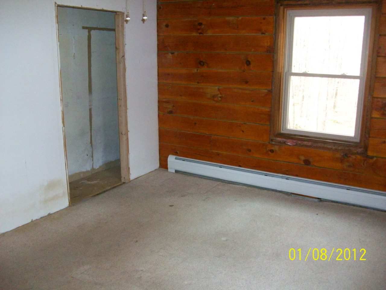 819 Bonny Rigg Hill Road Becket, MA 01223 - Photo 5 of 7 a view of an empty room with a window