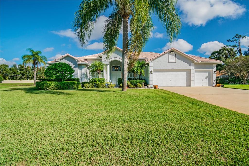 3902 Hidden Spring Place Valrico, FL 33596 - Photo 1 of 1 a front view of a house with garden