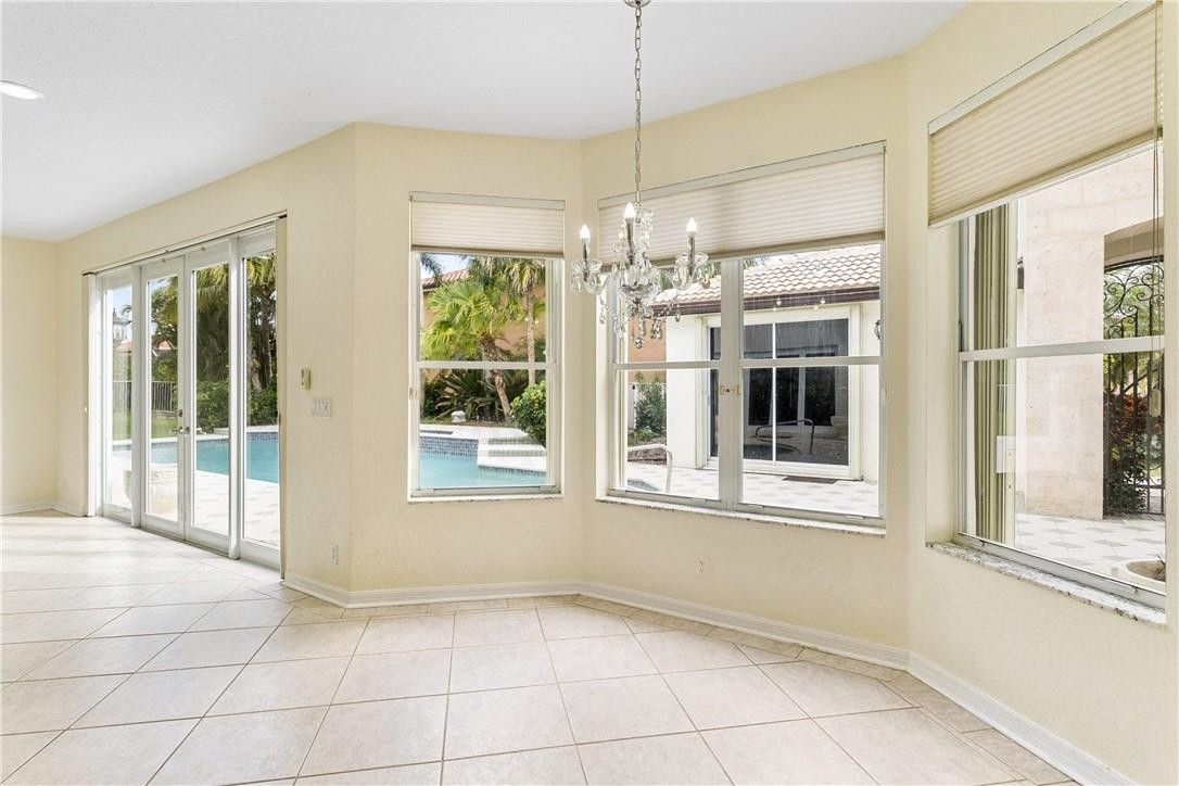 10945 Ravel Court Boca Raton, FL 33498 - Photo 14 of 24 a view of an empty room with a window