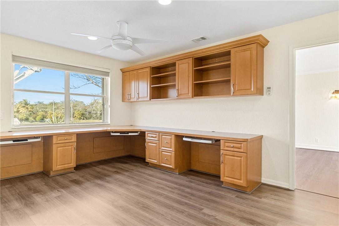 10945 Ravel Court Boca Raton, FL 33498 - Photo 16 of 24 a kitchen with stainless steel appliances granite countertop a stove a sink and a microwave