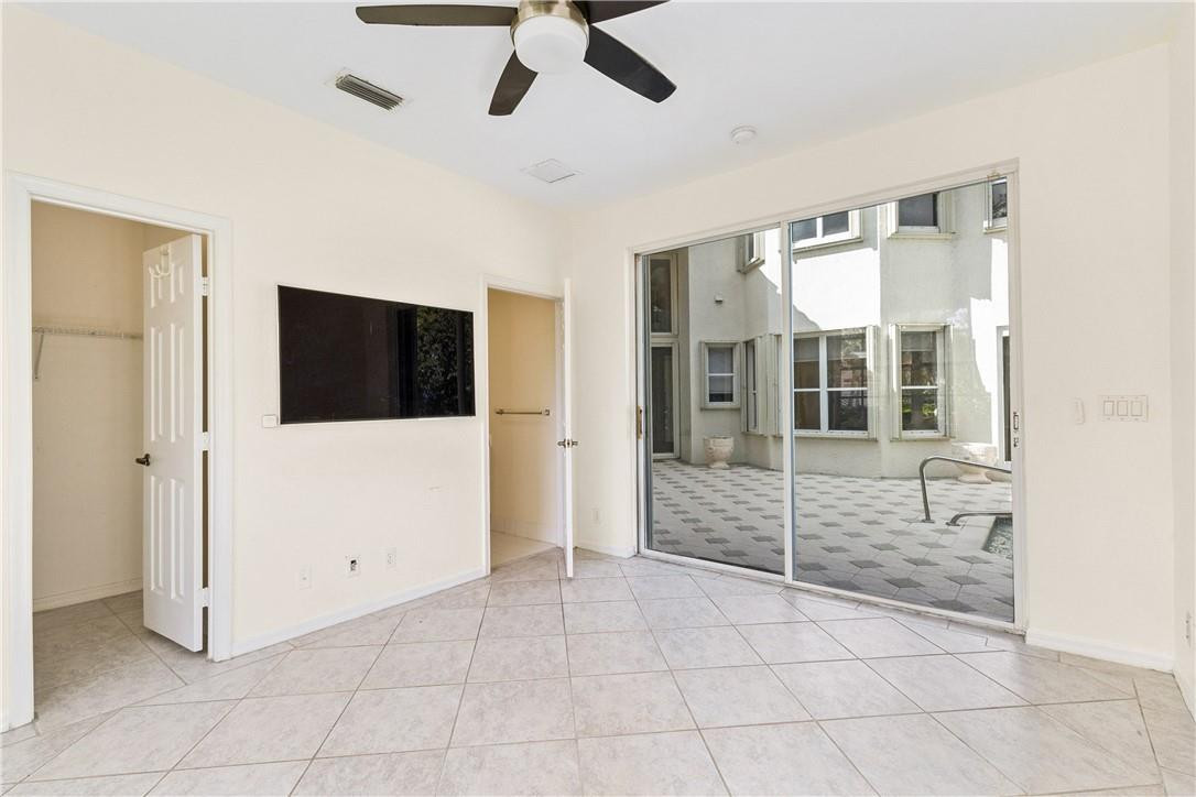 10945 Ravel Court Boca Raton, FL 33498 - Photo 20 of 24 a living room with a large window