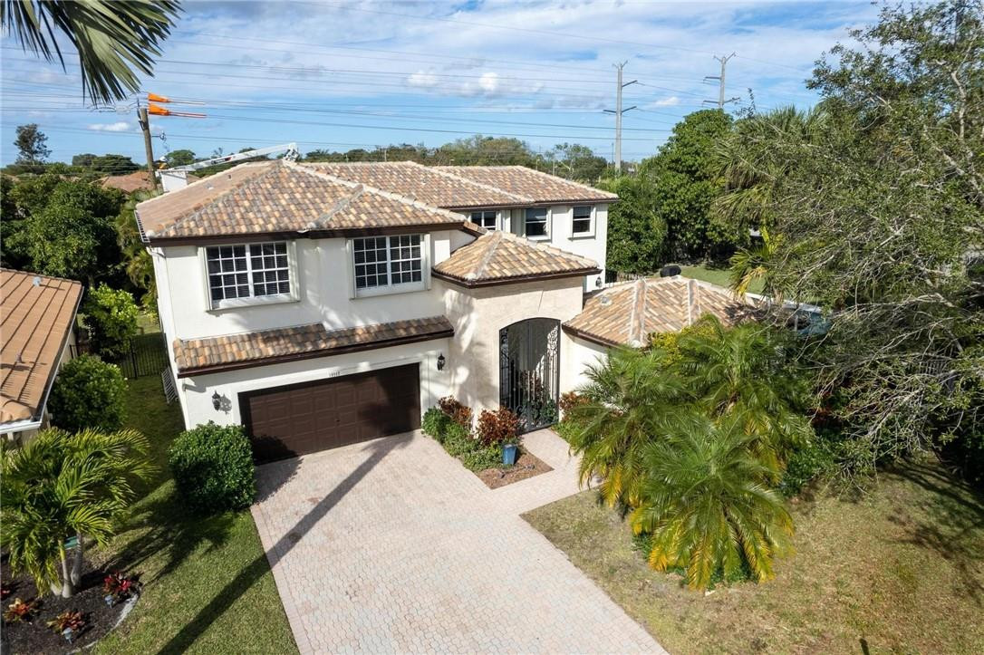 10945 Ravel Court Boca Raton, FL 33498 - Photo 21 of 24 an aerial view of a house with a yard