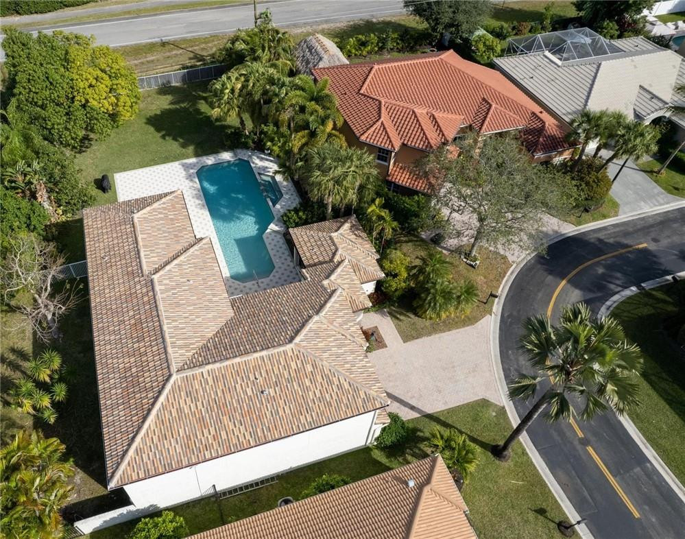 10945 Ravel Court Boca Raton, FL 33498 - Photo 24 of 24 an aerial view of a house with garden space and a street view