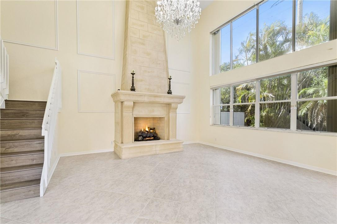 10945 Ravel Court Boca Raton, FL 33498 - Photo 7 of 24 a view of an empty room with a fireplace