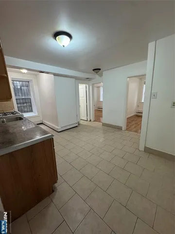 a view of an empty room and a window