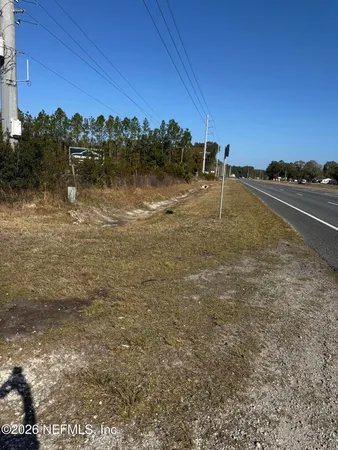 a view of a lake with a yard