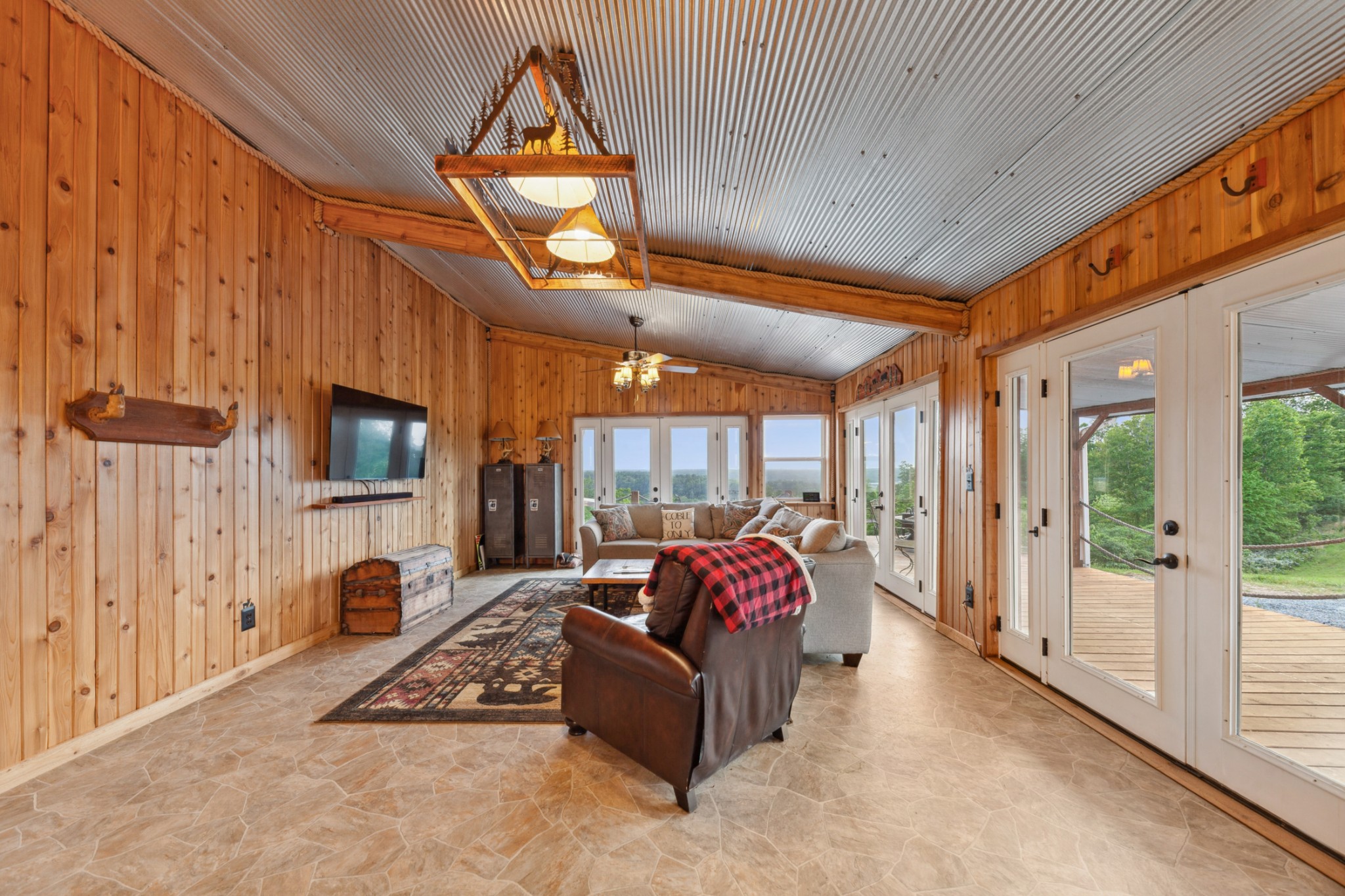 3383 Coble To Only Road Nunnelly, TN 37137 - Photo 24 of 75 a living room with furniture a flat screen tv and a floor to ceiling window