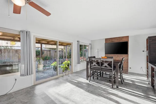 a view of a livingroom with furniture and a flat screen tv