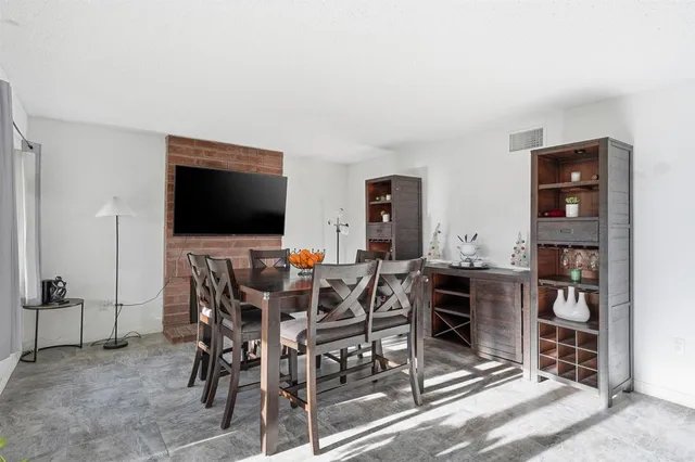 a view of a livingroom with furniture and flat screen tv