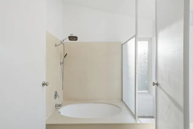 a bathroom with a sink and shower