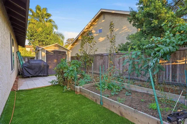 a view of a patio with table and chairs potted plants with wooden floor