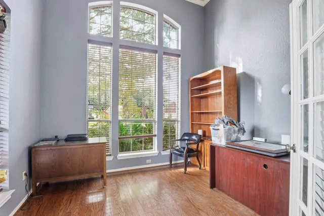 a front view of a house with plants