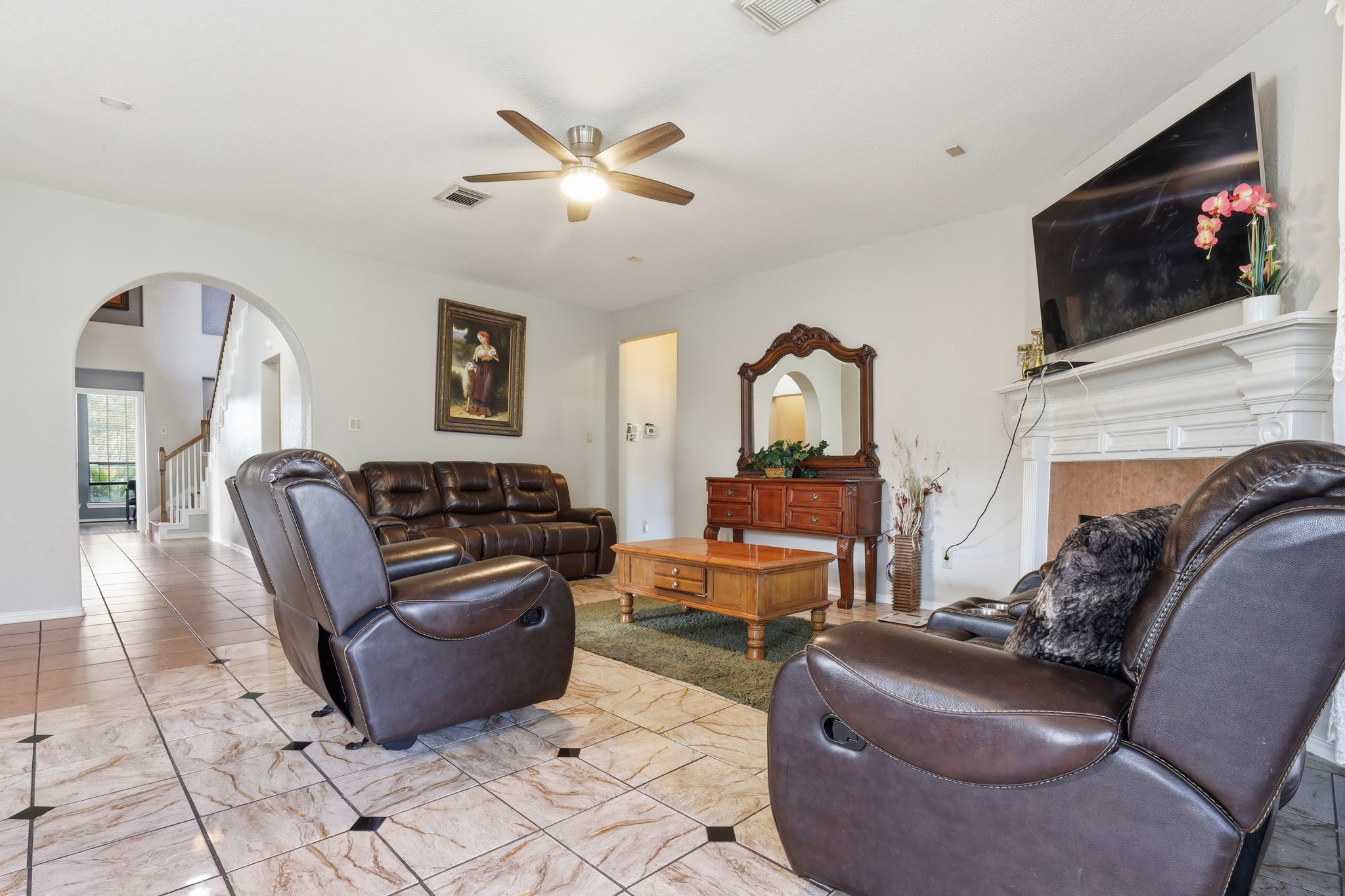 8202 Terrace Brook Drive Houston, TX 77040 - Photo 3 of 23 Spacious living room features an arched entryway and fireplace
