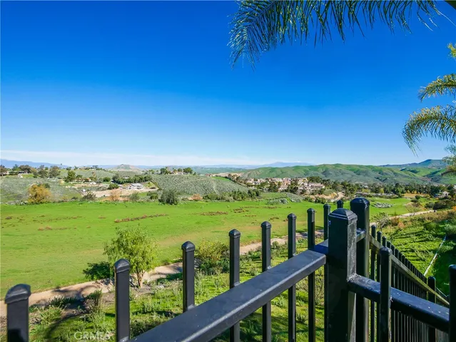 a view of a balcony with an outdoor space
