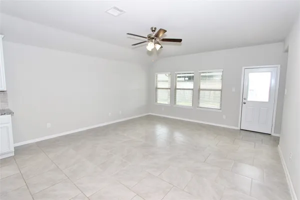 a view of an empty room with a window